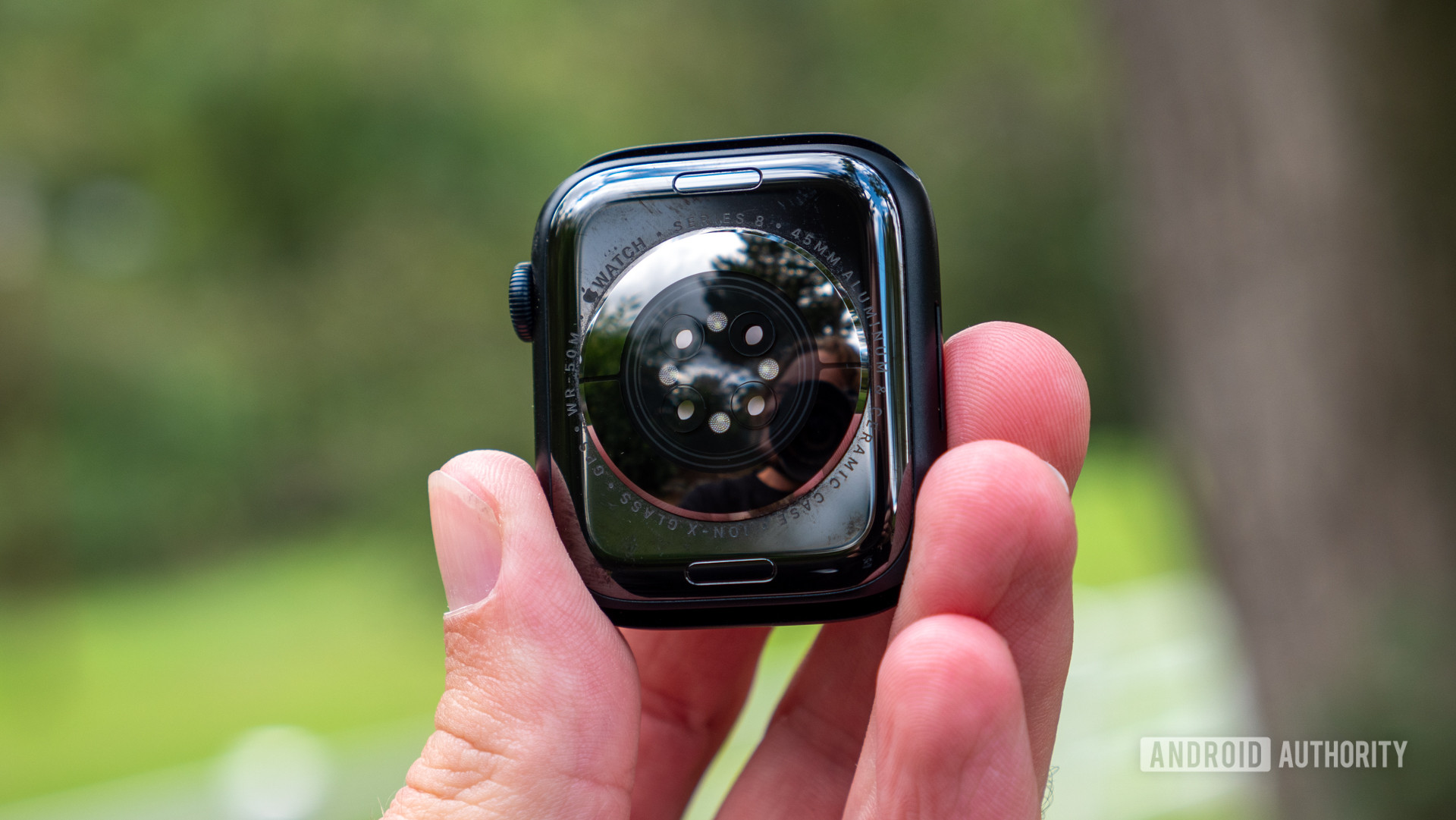 Apple Watch Series 8 rear view in hand showing sensor