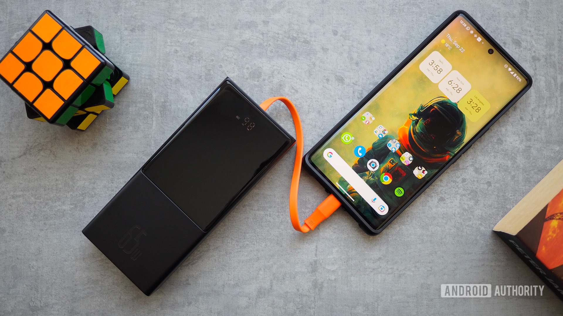 Baseus 65W portable battery with built-in USB-C cable plugged into Pixel 6 Pro