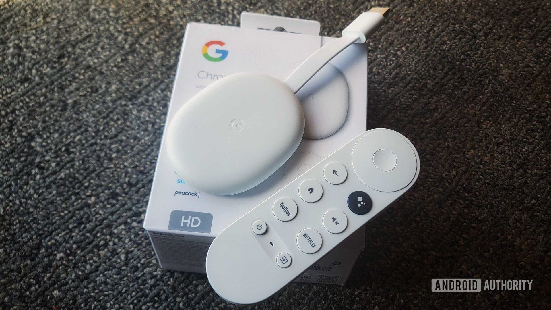 chromecast with google tv hd box, remote, and dongle