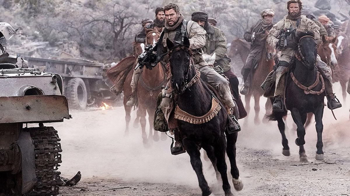 12 Strong Modern-day soldiers on horseback in 12 Strong - war movies on Netflix