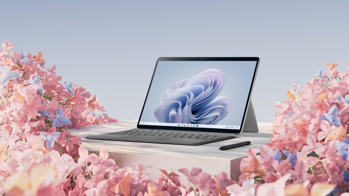 laptop next to flowers