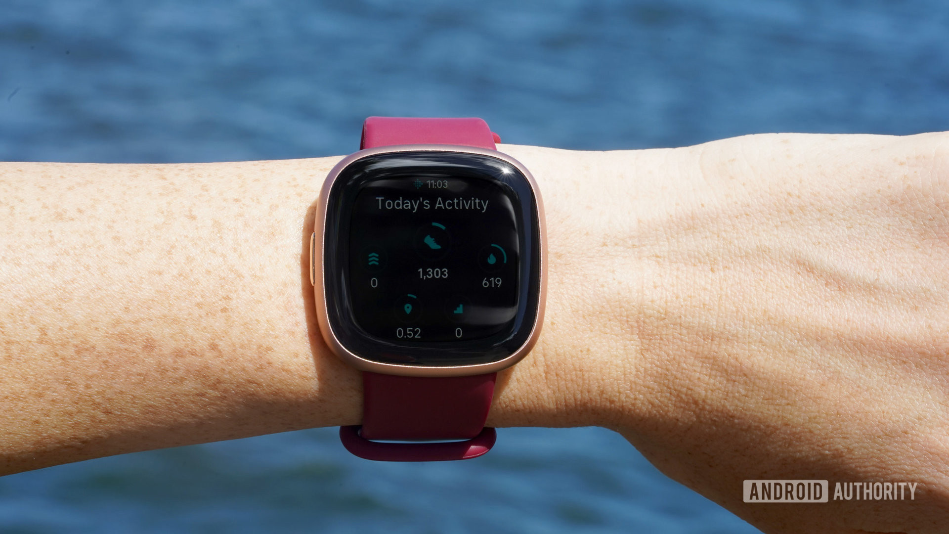 A Fitbit Versa 4 displays a user's daily activity stats.