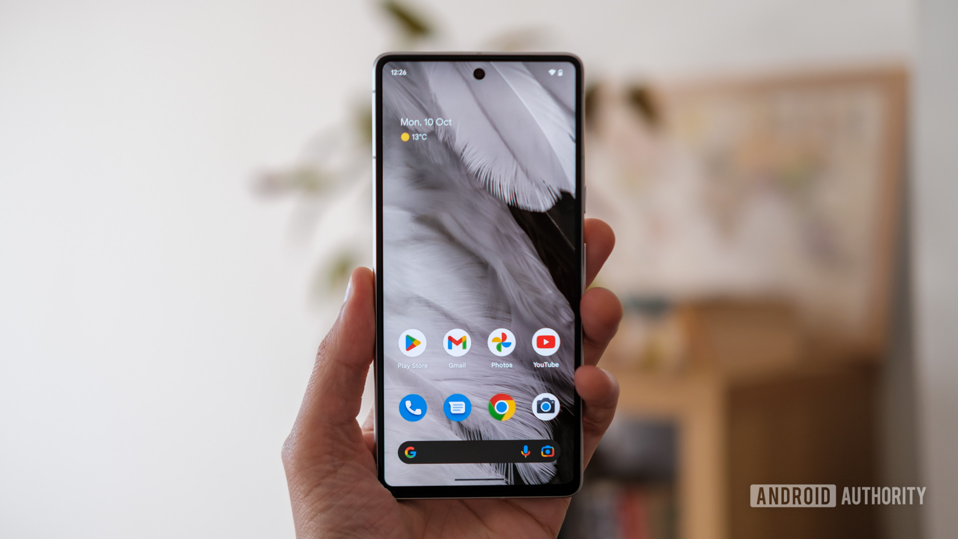 Google Pixel 7 home screen in hand - How to get out of Safe Mode