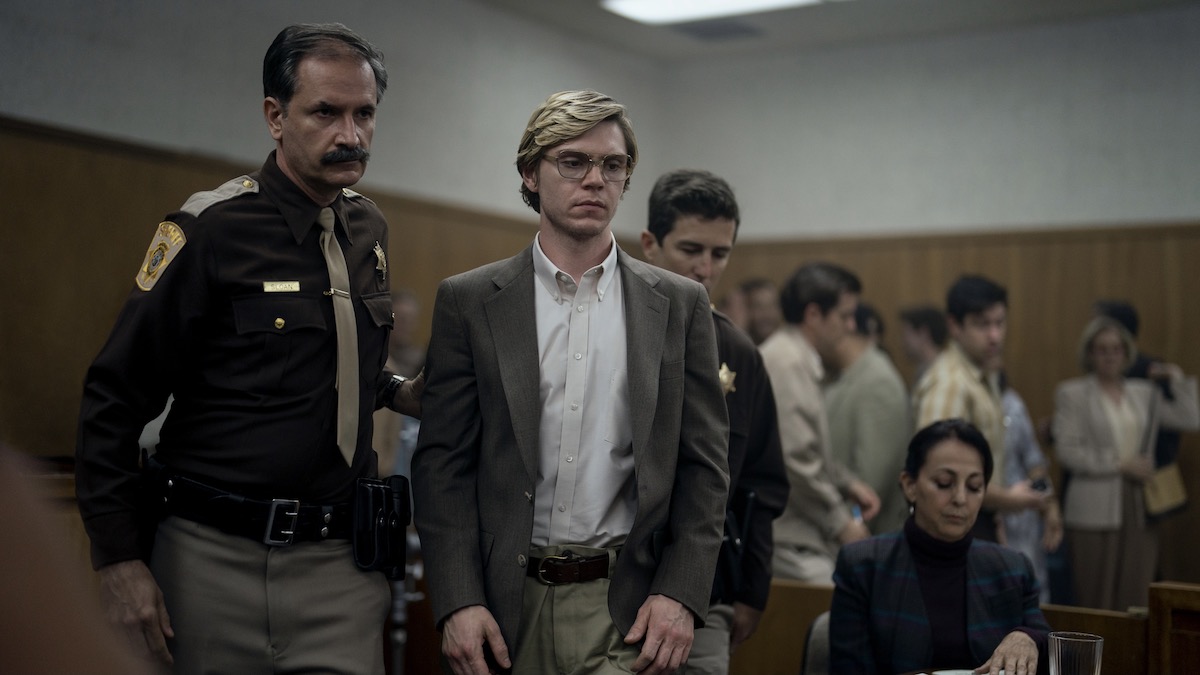 Evan Peters as Jeffrey Dahmer standing in court in Monster: The Jeffrey Dahmer Story - Netflix Jeffrey Dahmer show