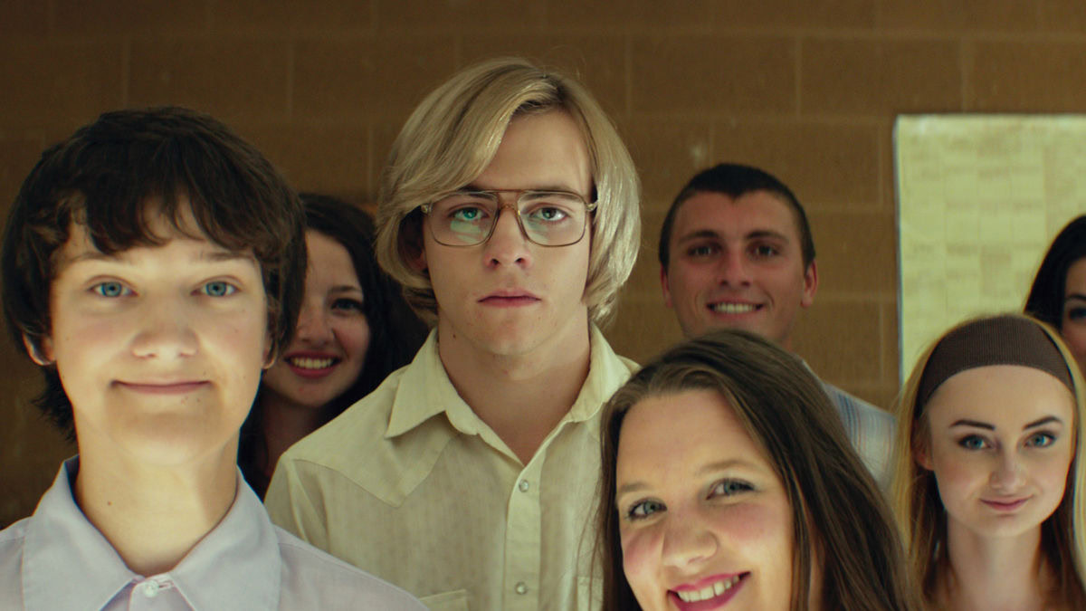 A young Jeffrey Dahmer in a crowd of teens in My Friend Dahmer - Netflix Dahmer show