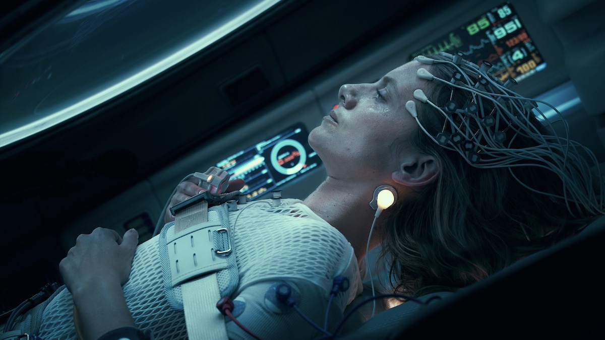 A woman wears brain monitors in Oxygen