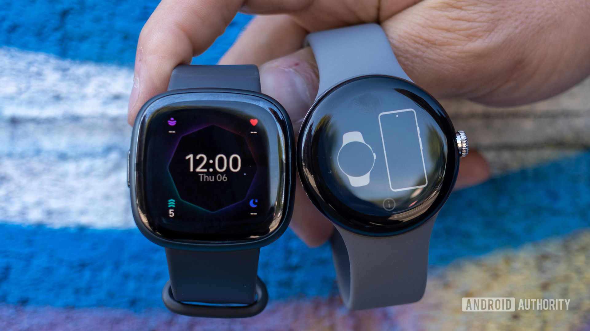 fitbit sense 2 vs google pixel watch held above