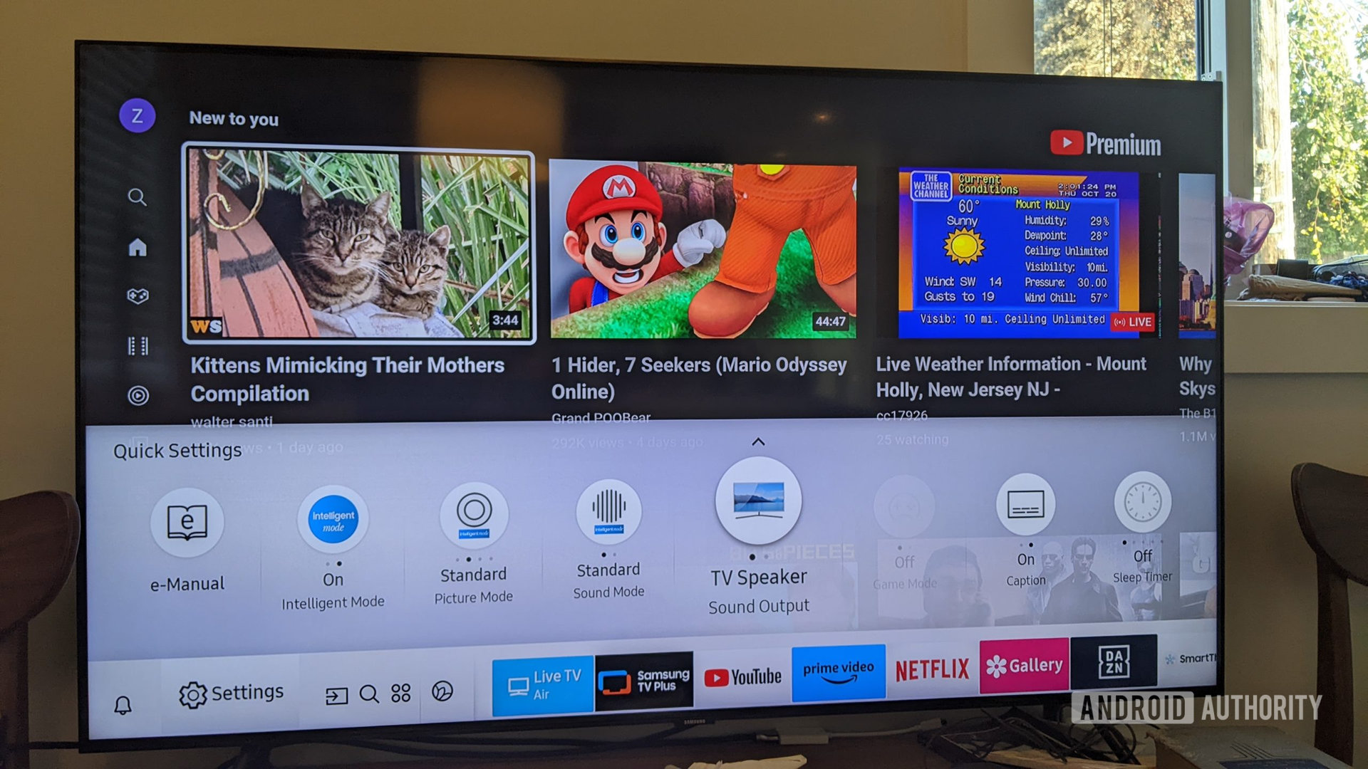 A photograph of a Samsung TV showing the settings menu.