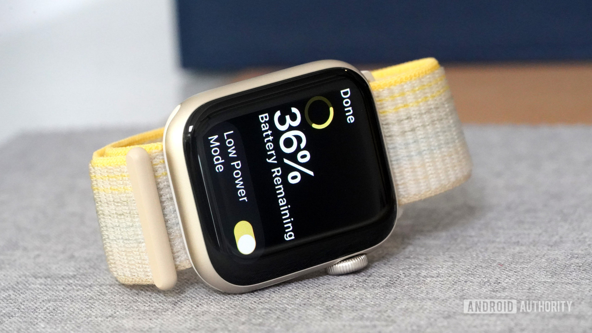 An Apple Watch SE 2 on its side, displays the Low Power Mode screen.