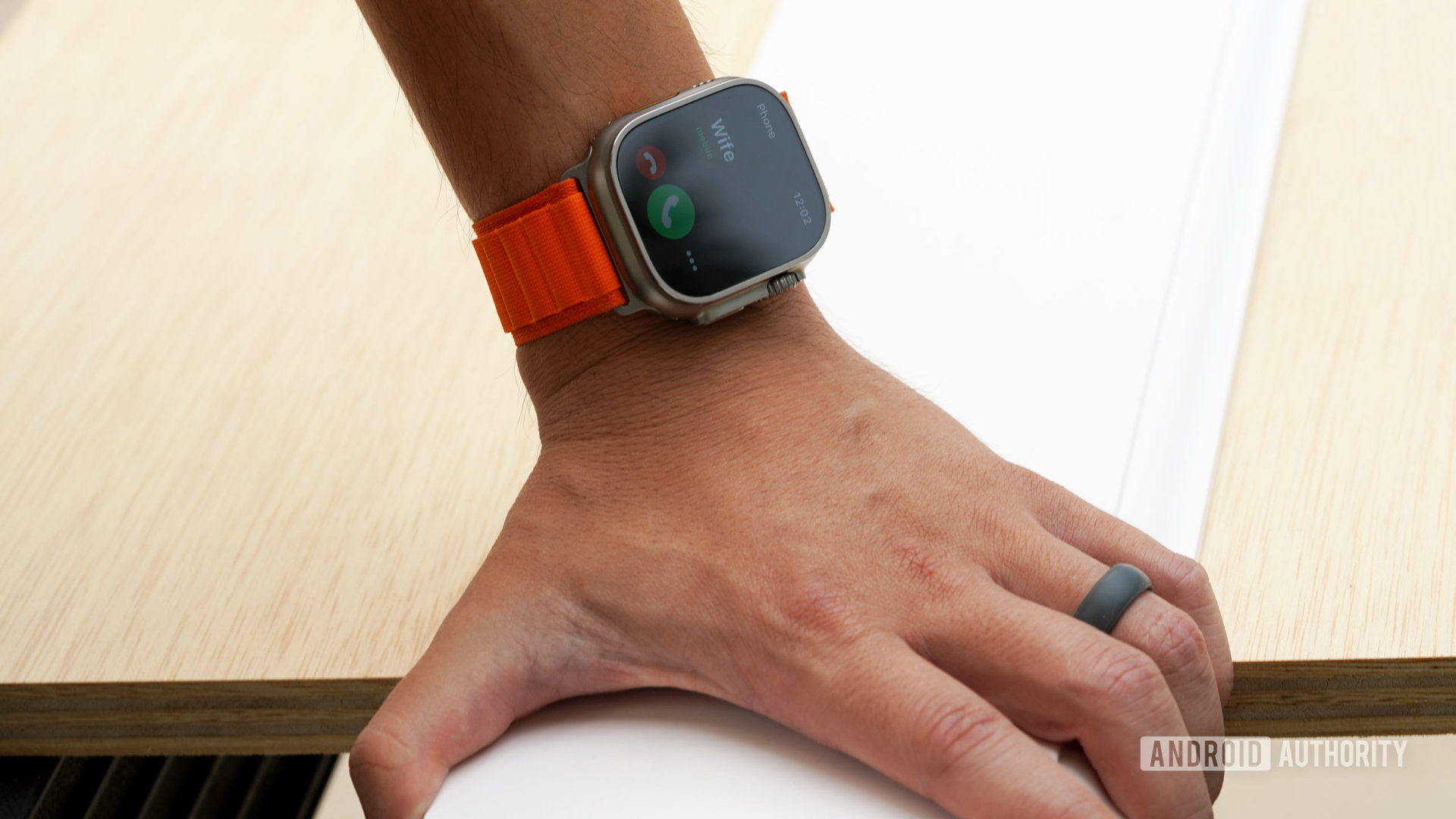 An Apple Watch Ultra on a user's wrist receives an incoming call.