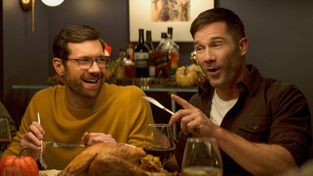 Two men at a dinner table in Bros