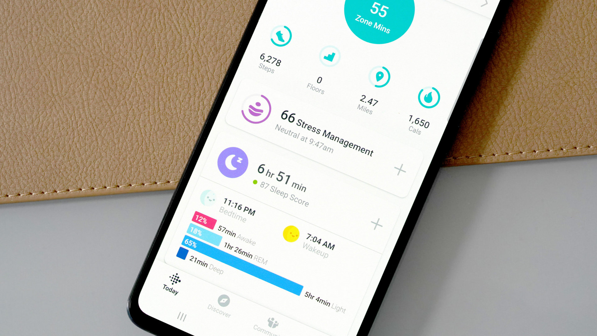 A Galaxy A51 displays the Fitbit App including a user's sleep and stress data.