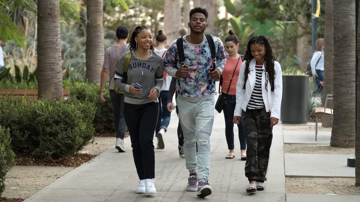 Chloe Bailery, Trevor Jackson, and Halle Bailey walking across campus in Grown-ish: Best Shows Like The Sex Lives of College Girls.