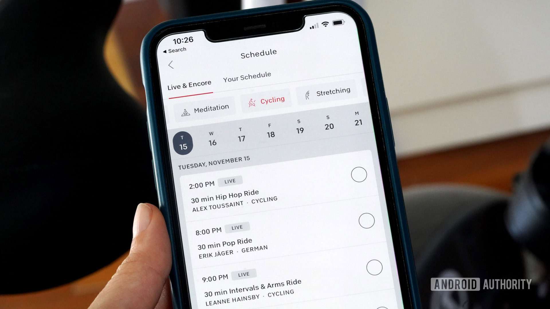 A user reviews their Peloton class schedule on their iPhone.