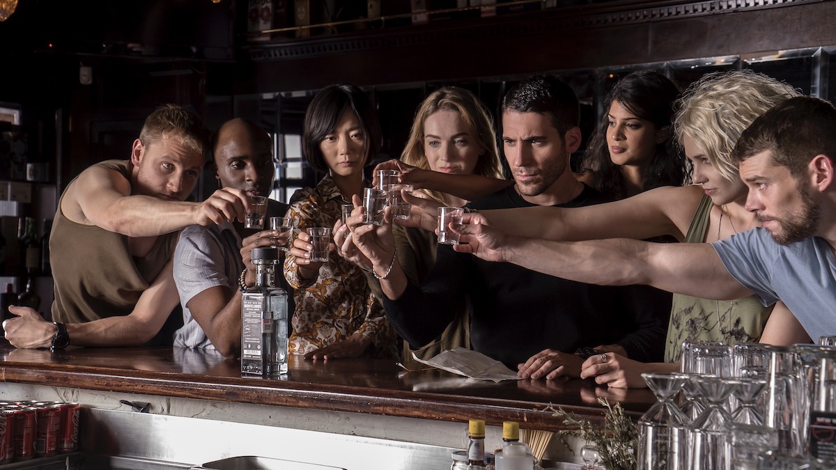 Eight characters drink together at a bar in Sense8 - best hidden gems on netflix