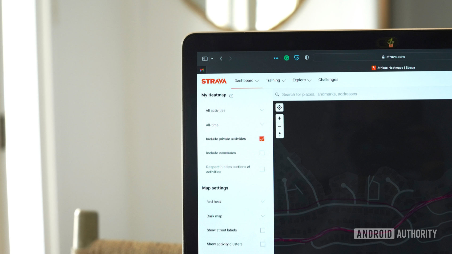 A MacBook displays a Strava user's Personal Heatmap.