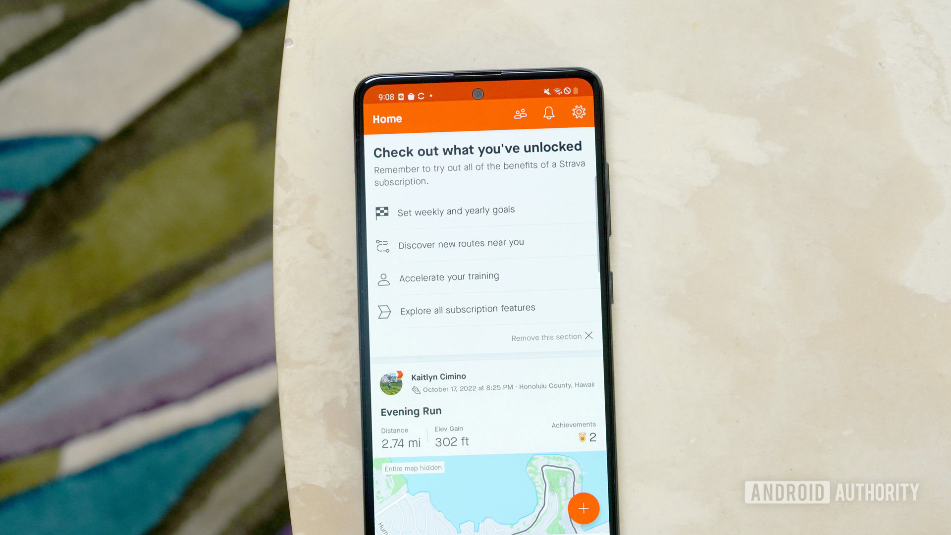 Galaxy A51 rests on a marble table displaying the newly opened Strava subscription.