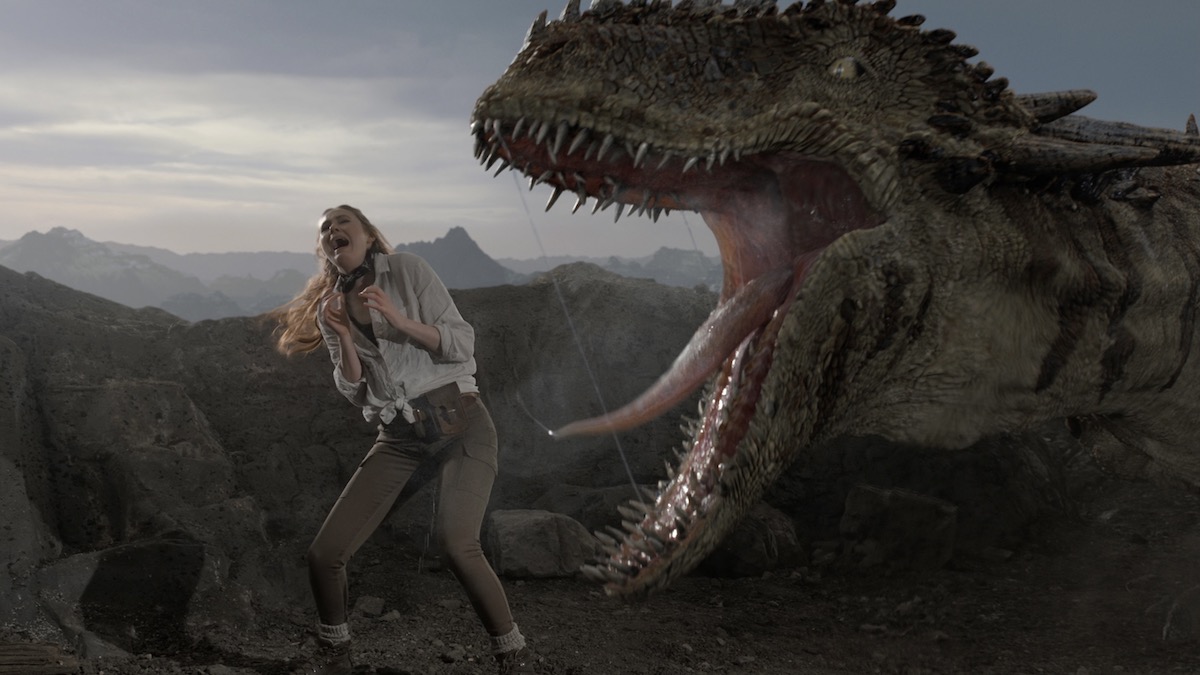 Karen Gillan as Carol Cobb running from a CGI T-Rex in The Bubble - streaming flops of 2022
