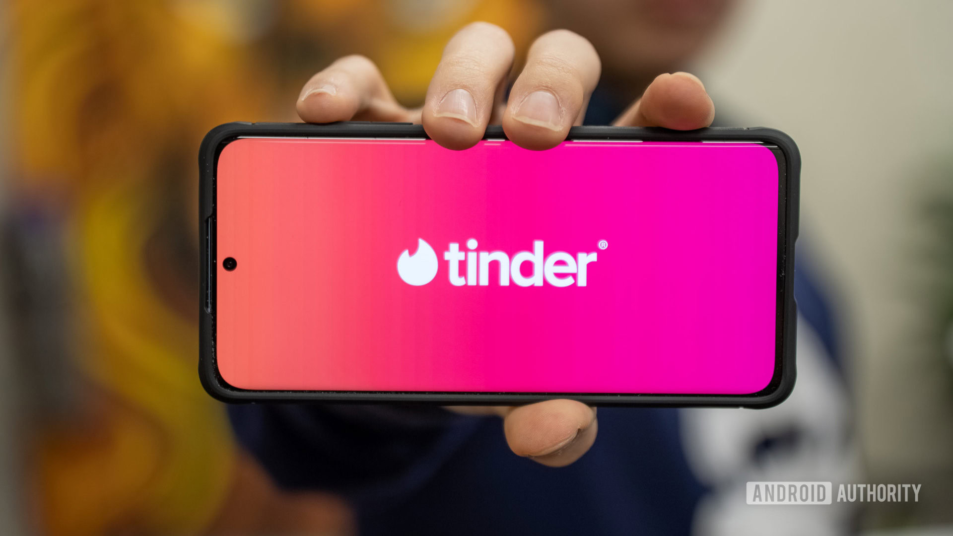 Tinder stock photo hand out app name