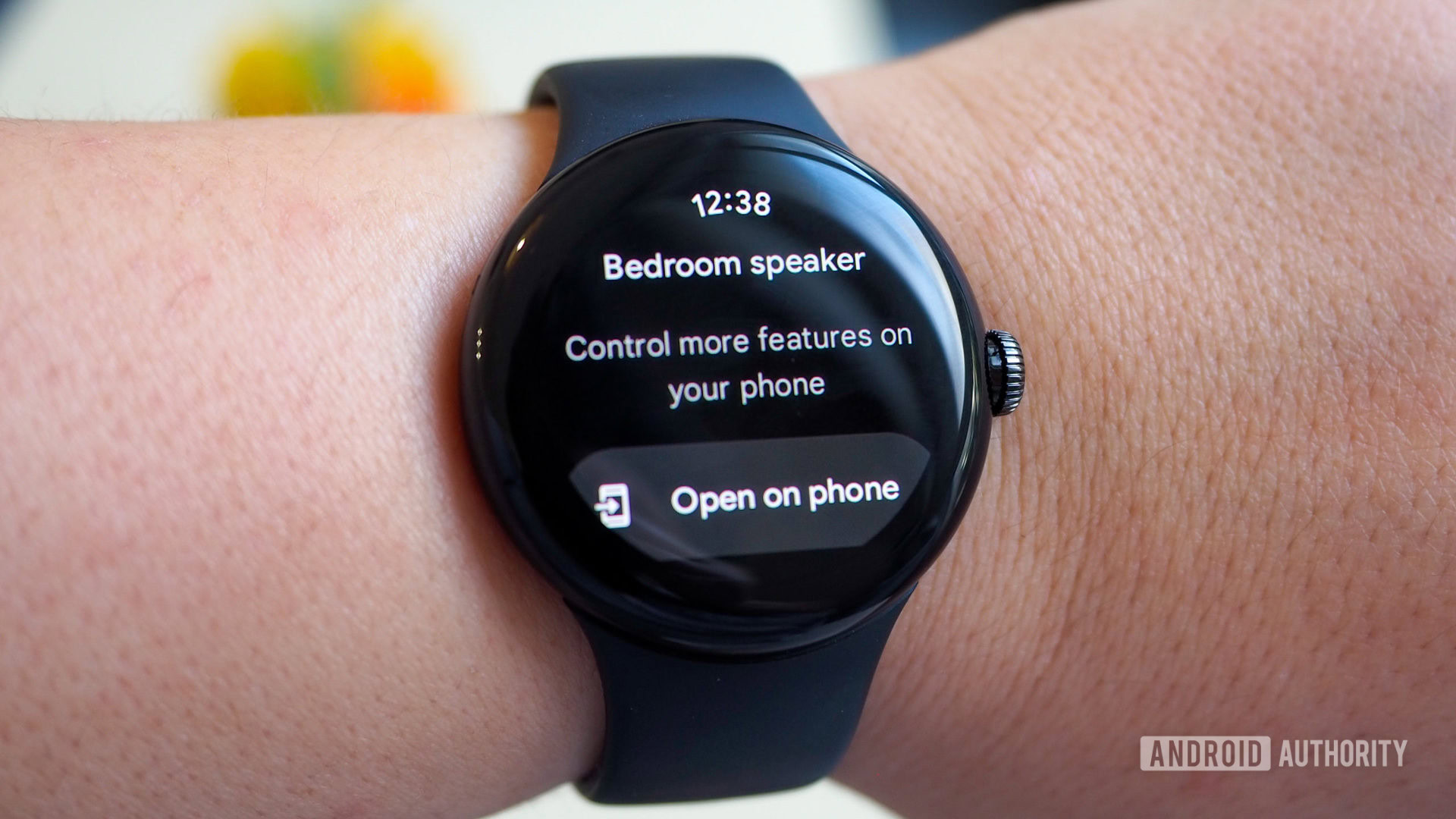 The Google Home app on the Pixel Watch displays a notification to open the app on the phone for more controls