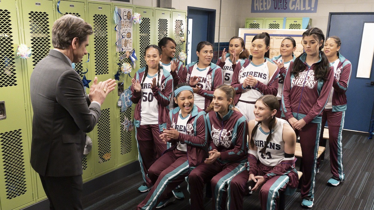 A girls basketball team with their coach in Big Shot - best sports shows