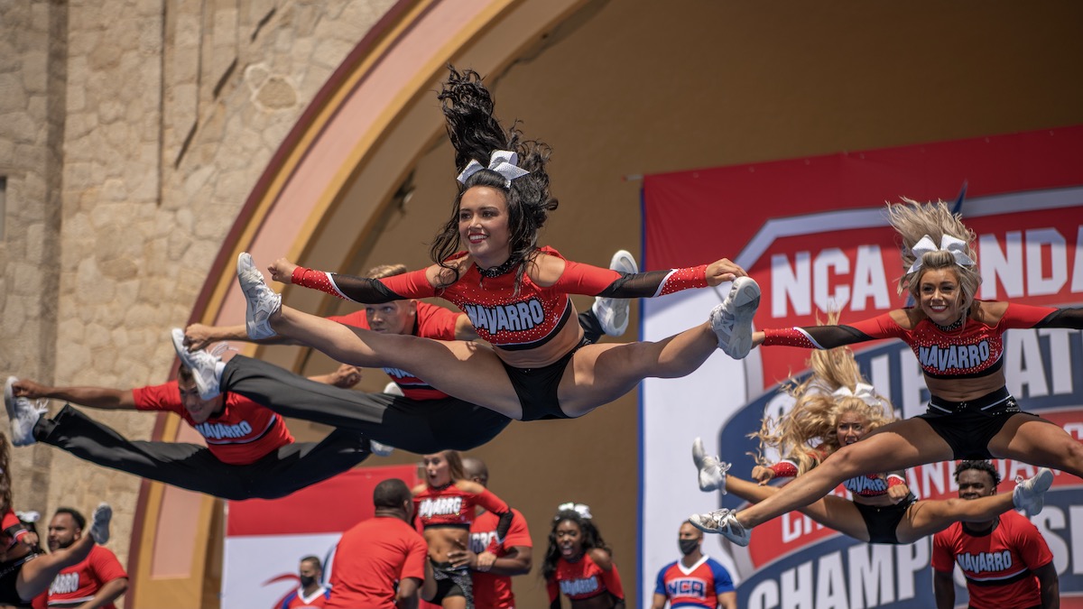 Maddy Brum and other cheerleaders performing in Cheer - best sports shows
