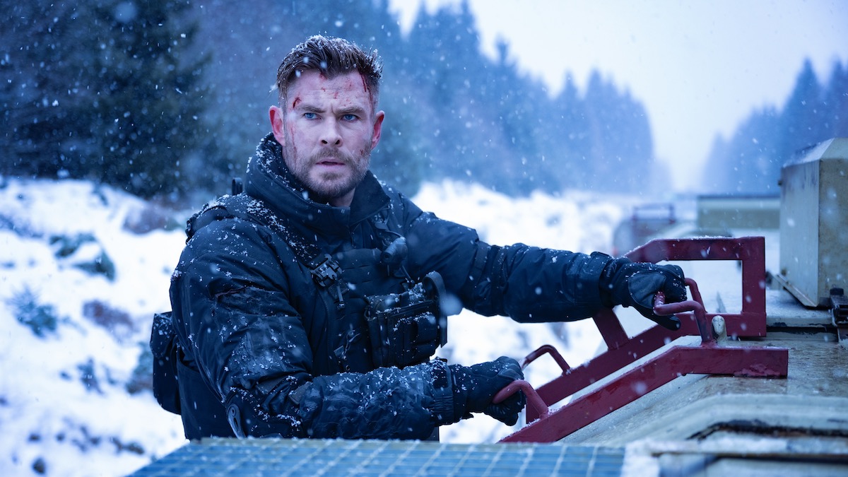 Chris Hemsworth on a train in winter in Extraction 2 - streaming movies in 2023