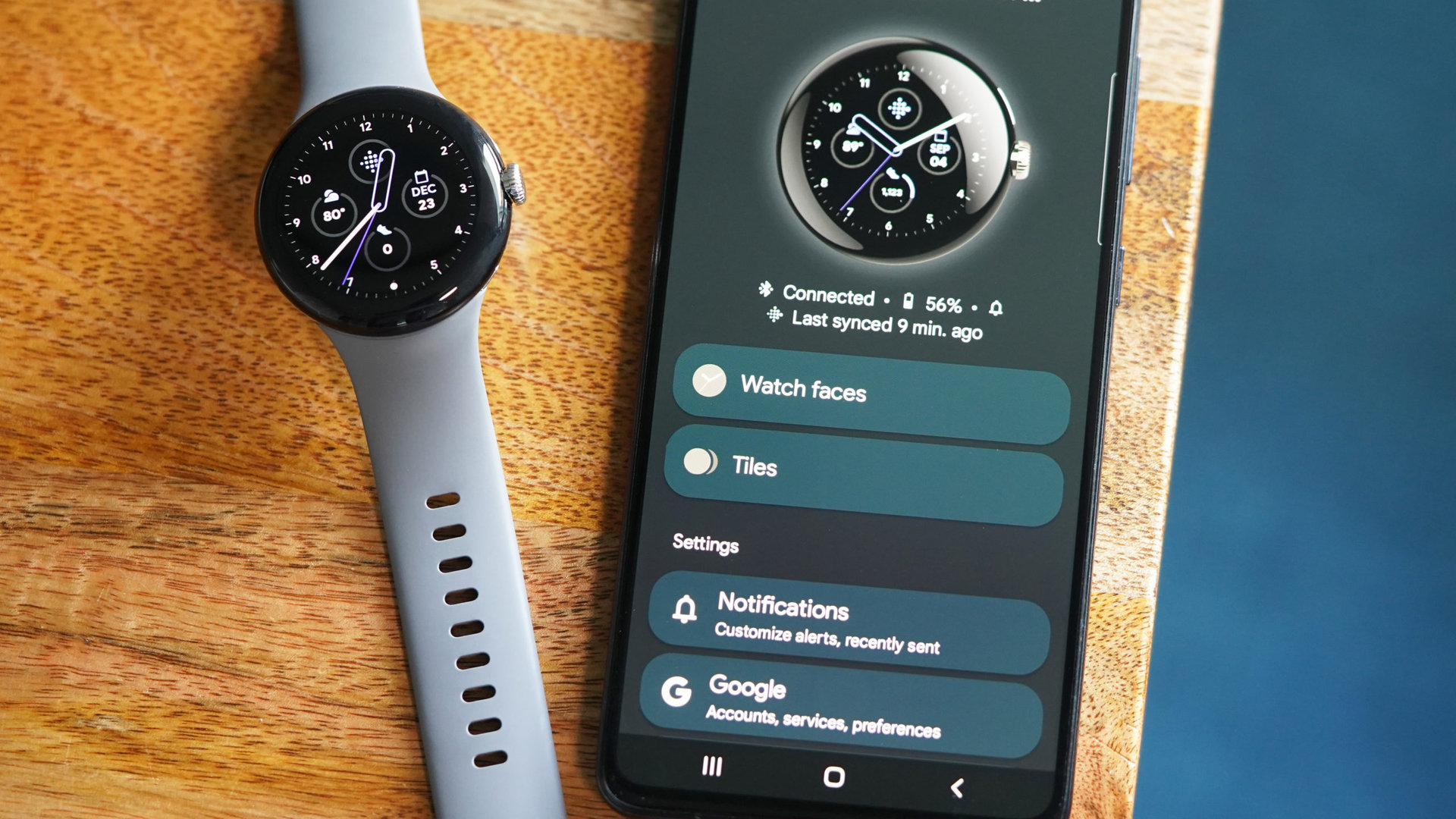 The Galaxy A51 displays the home screen of the Pixel Watch app.
