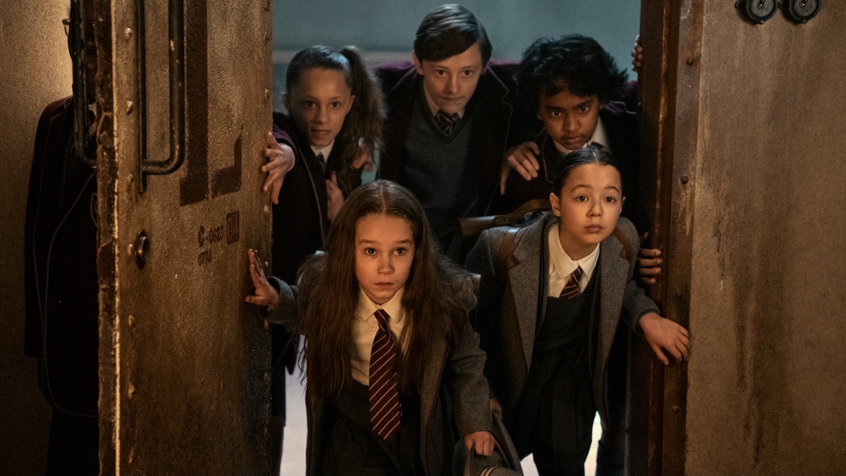 School children crowd around a doorway in Roald Dahl's Matilda The Musical - best new streaming movie