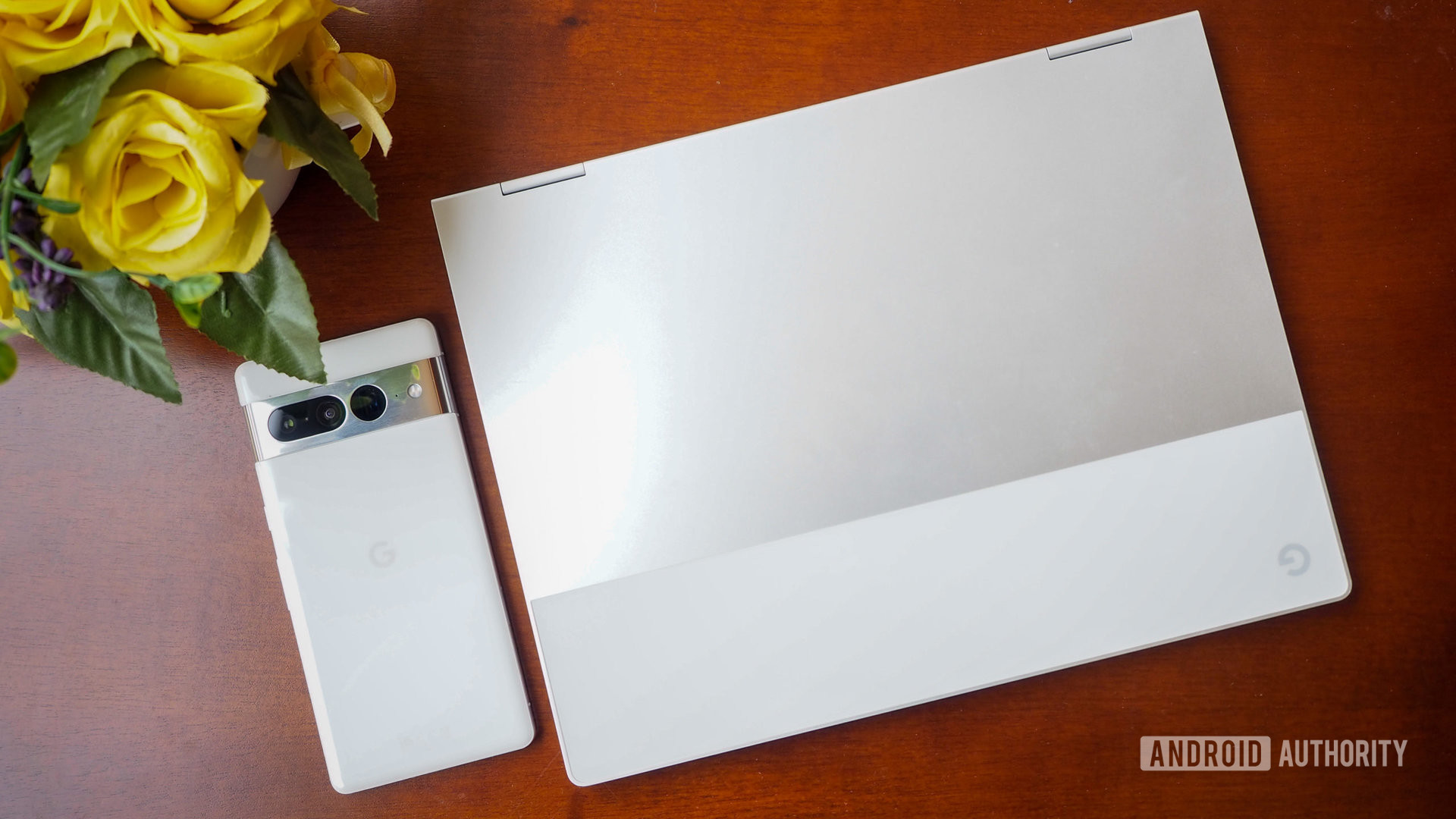 Google Pixelbook and Pixel 7 Pro on a brown table