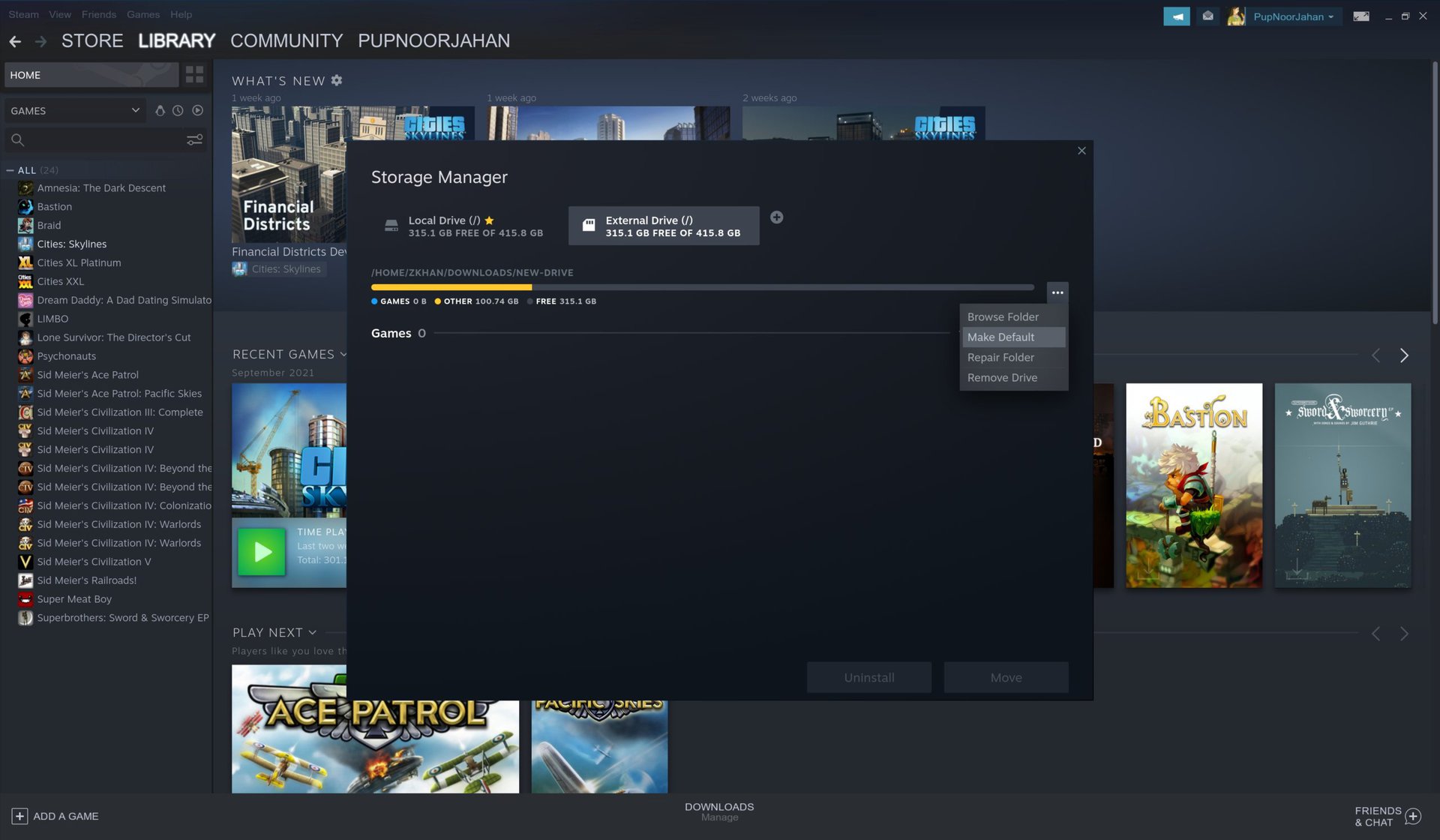 A screenshot of the Steam settings window showing the Steam Library Folders window showing the context menu for a folder with the option the make it the default highlighted.