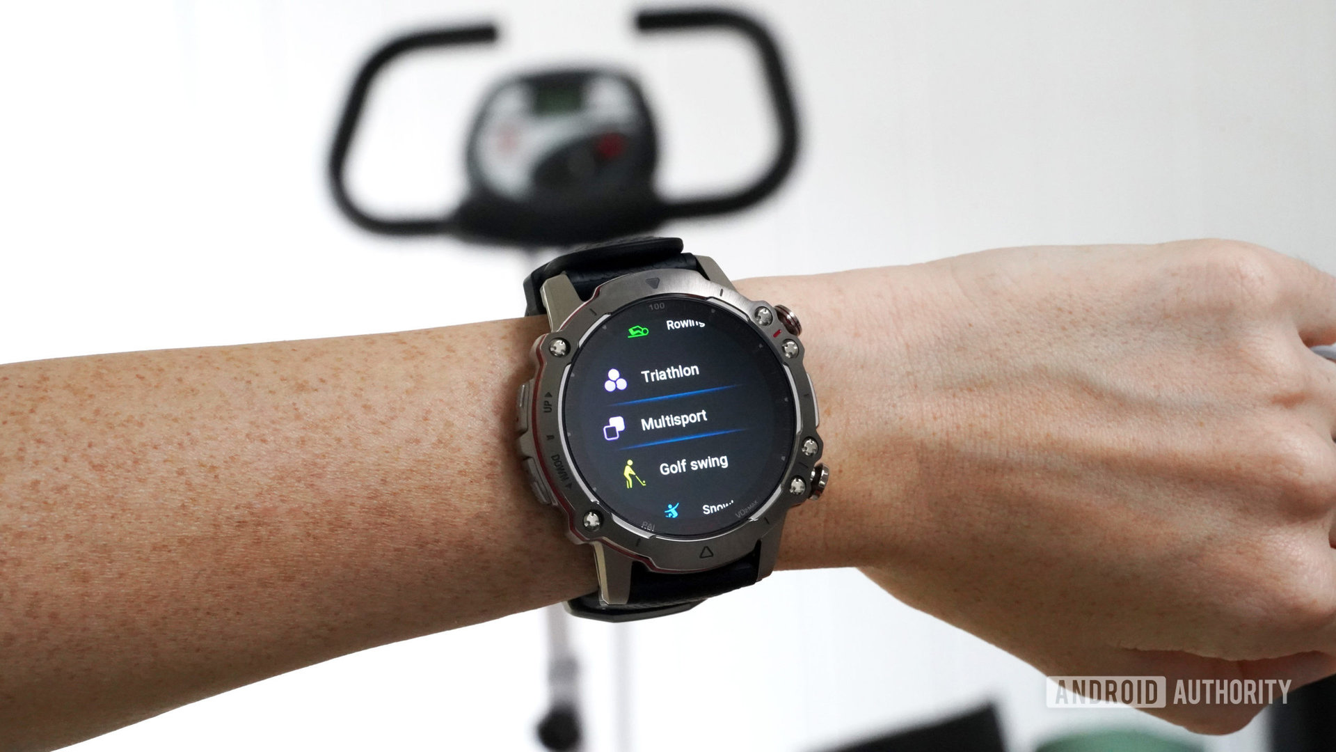 An Amazfit Falcon on a user's wrist displays workout modes.