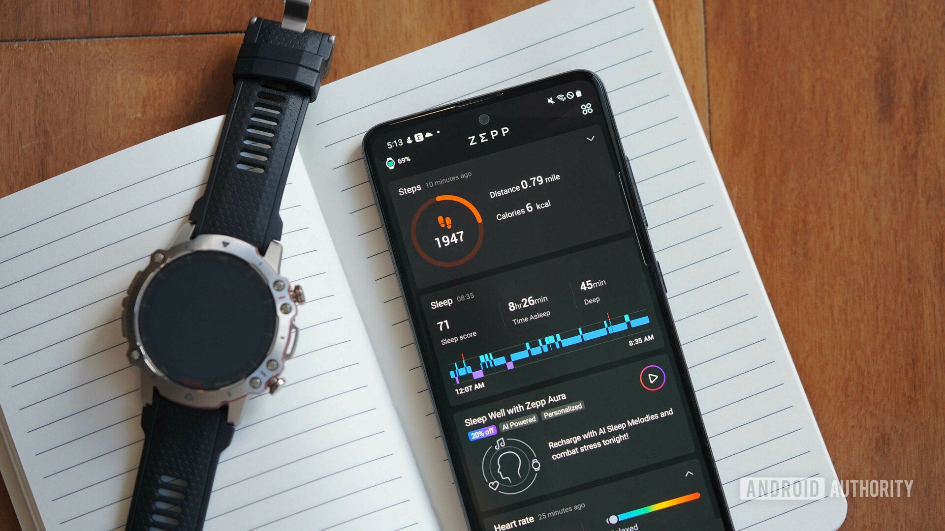 An Amazfit Falcon rests alongside an Android phone displaying the Zepp app.