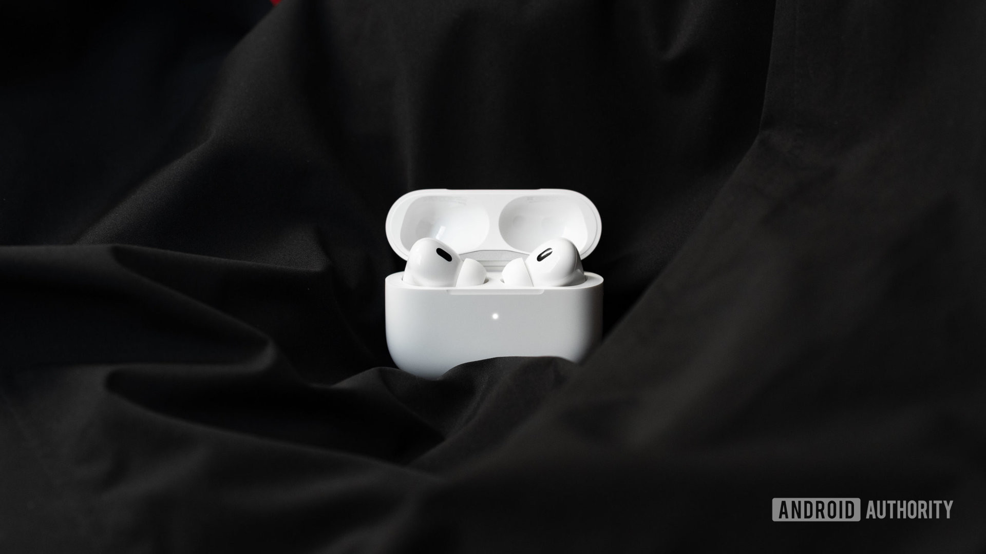 The Apple AirPods Pro (2nd generation) case is open to reveal the noise cancelling wireless earbuds inside.