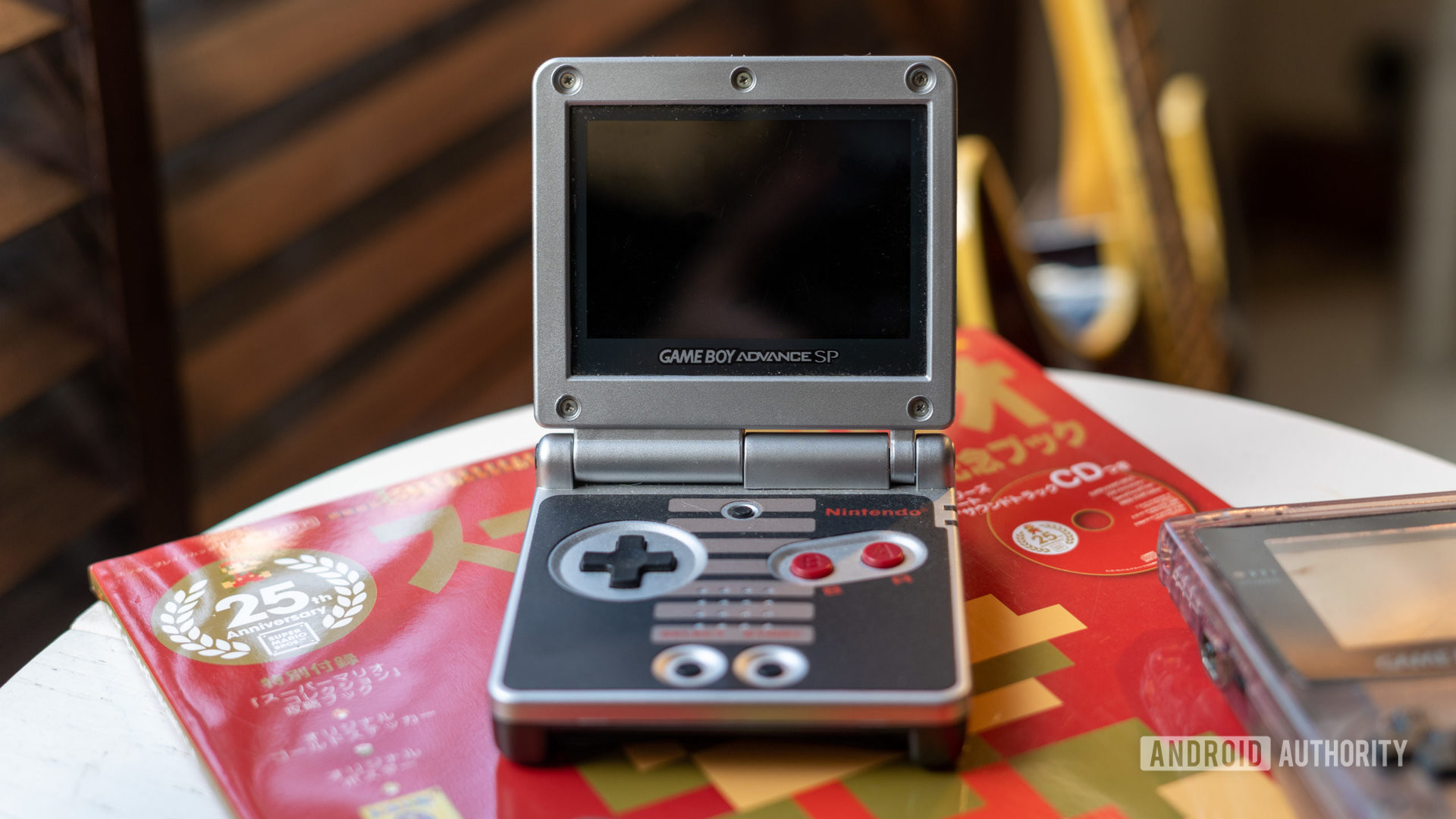GameBoy Advance SP placed in a magazine