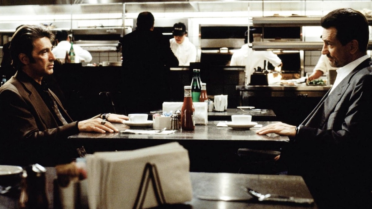  Al Pacino and Robert De Niro sit across from each other in a café in Heat