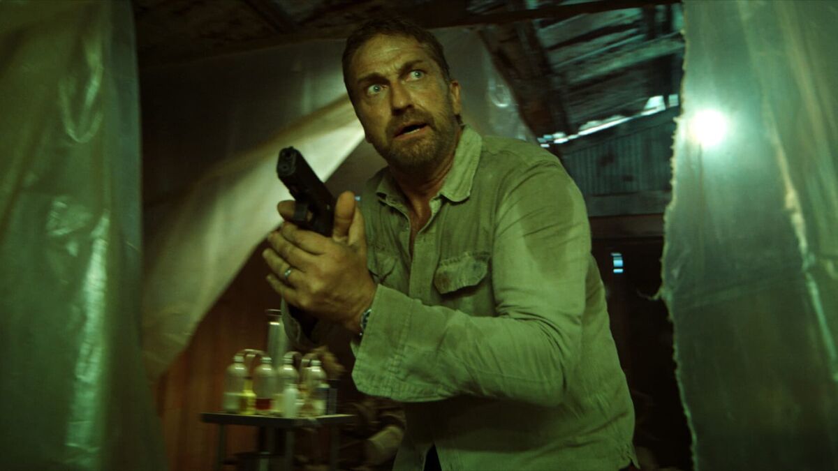 Gerard Butler holding a gun in Last Seen Alive