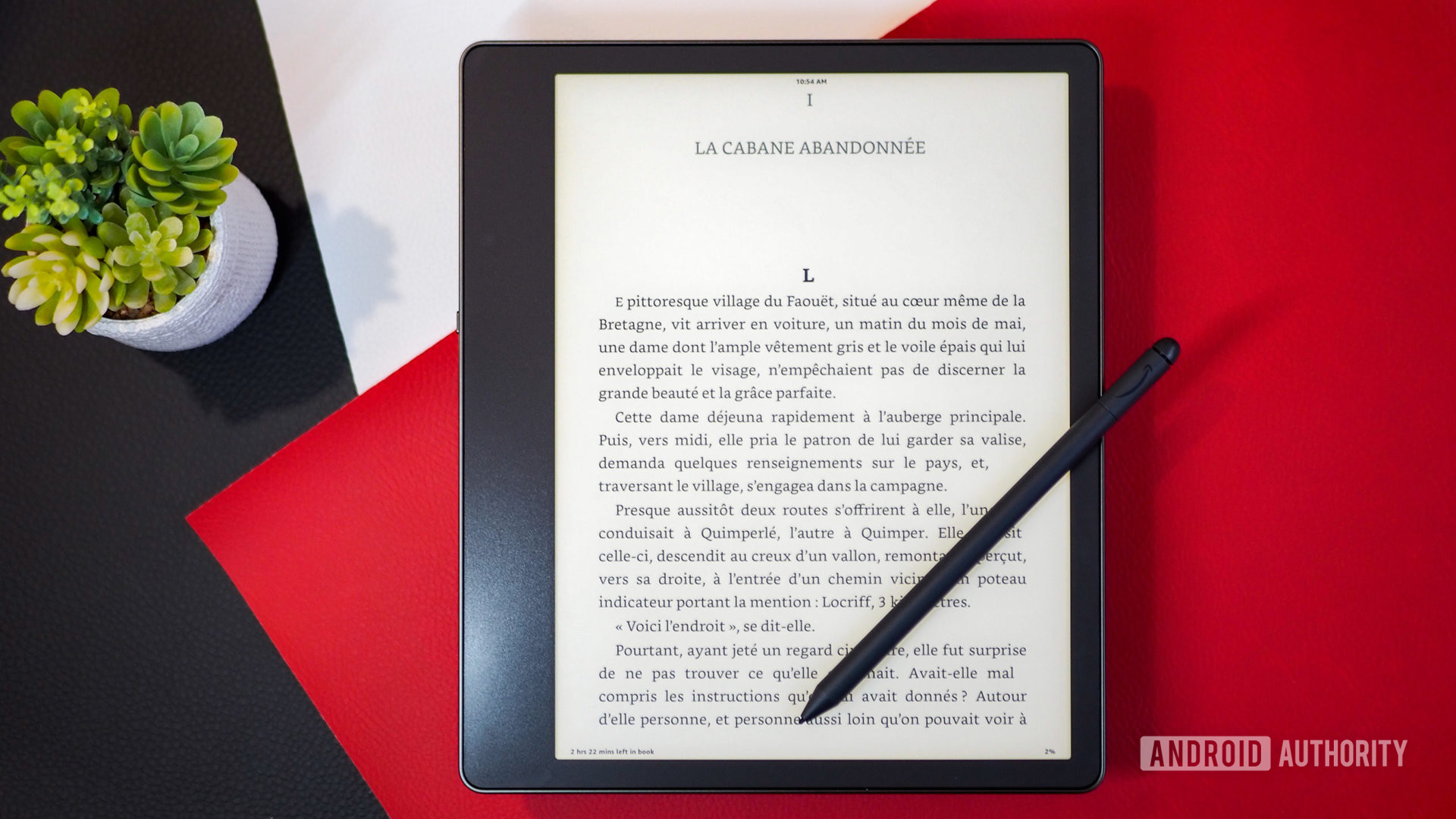 An ebook open on the Amazon Kindle Scribe with the Premium Pen resting on the display - E-Ink tablets