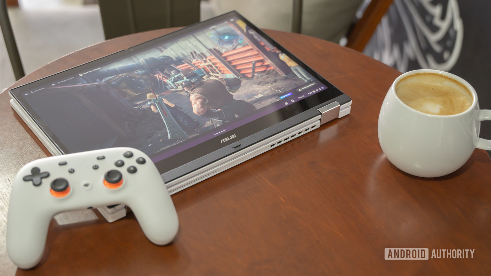 ASUS Chromebook Vibe CX34 Flip in tablet mode next to controller and coffee