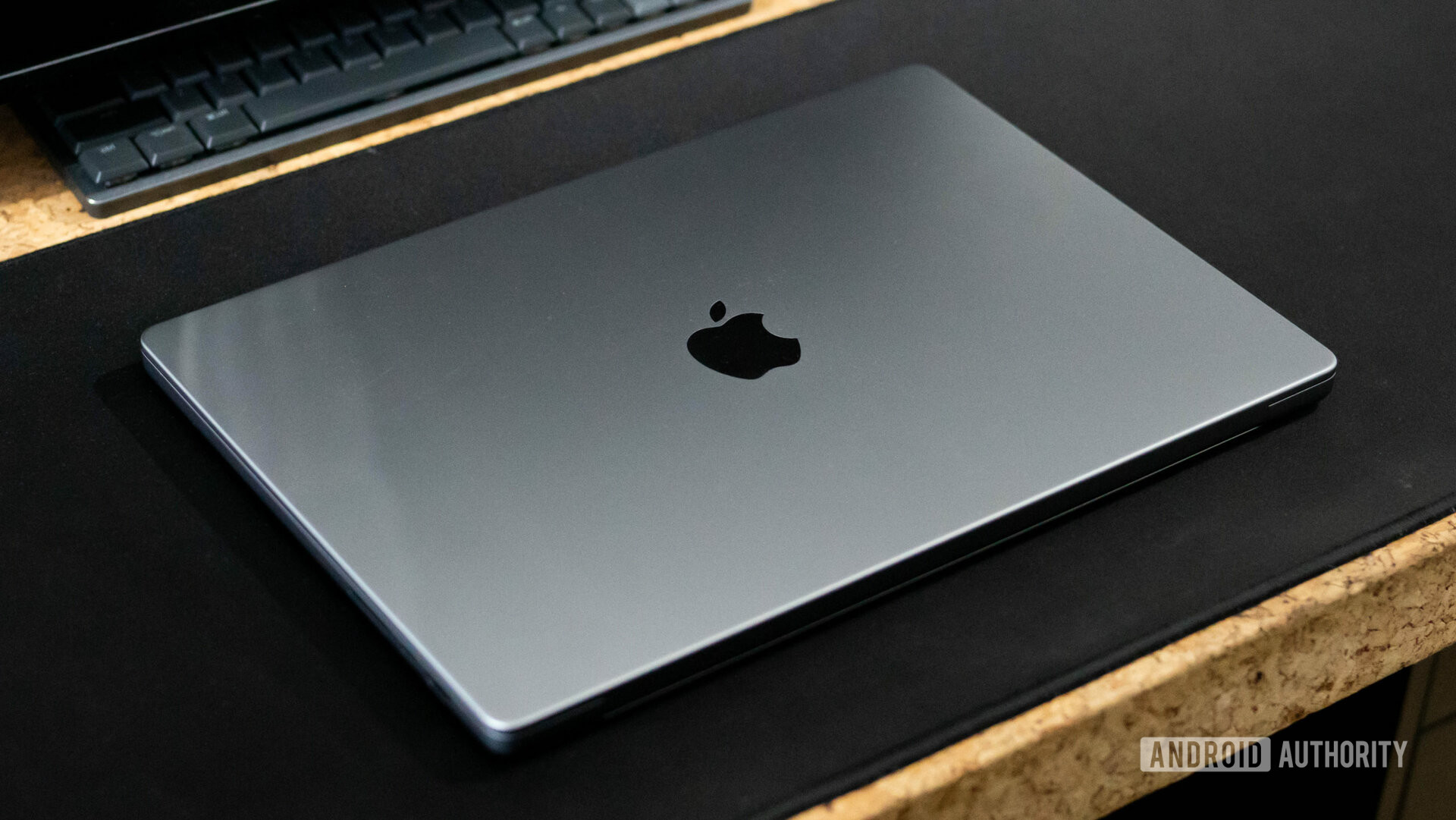 Apple MacBook Pro 2023 closed on a desk showing Apple logo