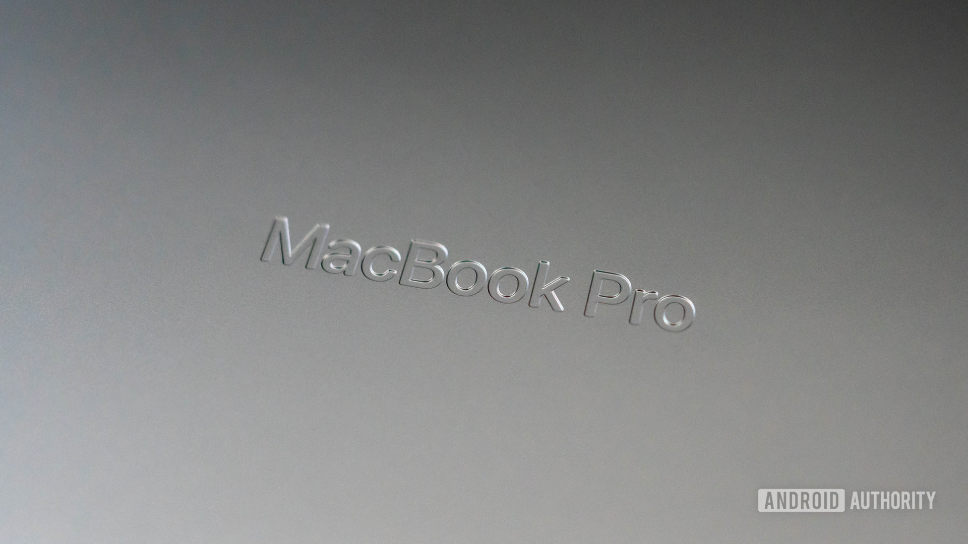 Apple MacBook Pro 2023 debossed logo on underside