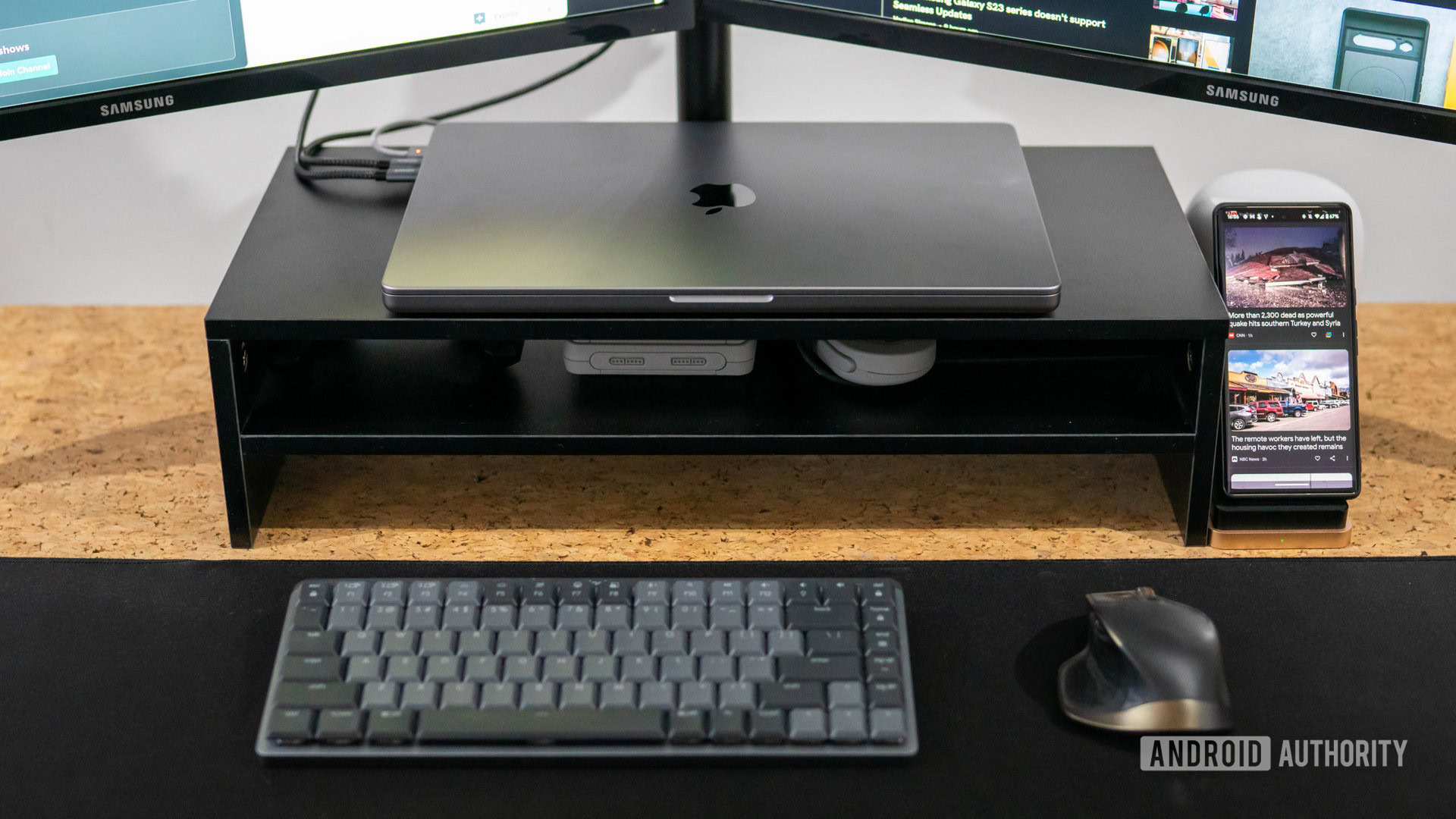 Apple MacBook Pro 2023 in clamshell mode with Bluetooth keyboard and mouse on desk