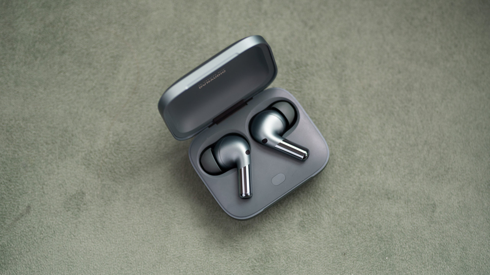 The OnePlus Buds Pro 2 noise cancelling wireless earbuds sit inside the open case.