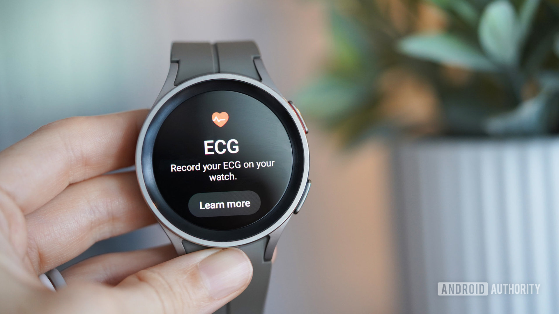 A Samsung Galaxy Watch 5 Pro displays the ECG app.