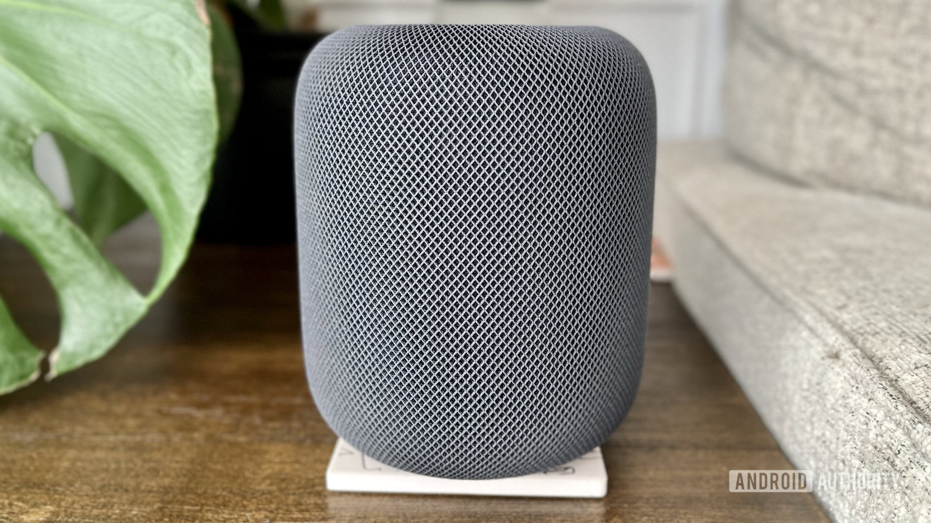 The HomePod 2nd gen on an endtable