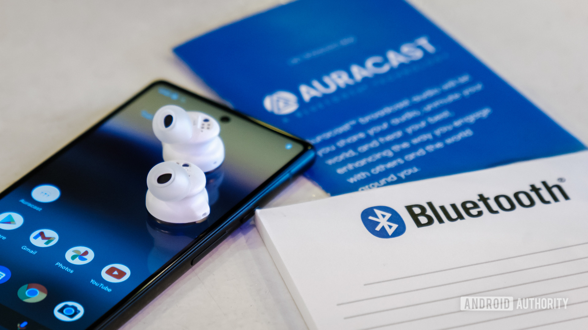 Bluetooth Auracast headphones and logo