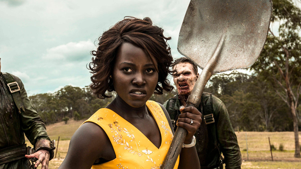 Lupita Nyong'o holds a shovel, surrounded by zombies in Little Monsters - best Hulu movies