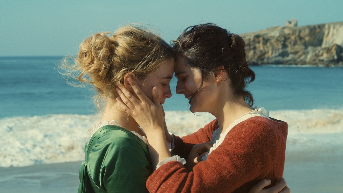 Two women on a beach embrace while crying in Portrait of a Lady on Fire - best Hulu movies