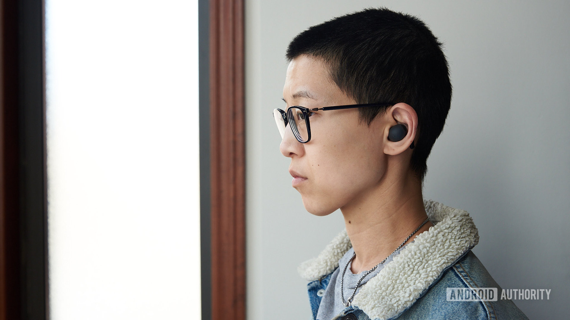 A person wears the Samsung Galaxy Buds 2 Pro earbuds.