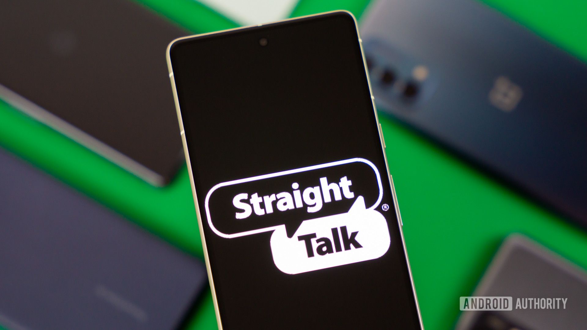 Stock photo of Straight Talk logo on phone with many devices 2